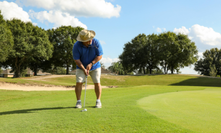 Man playing golf on course
